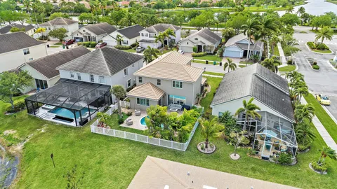 an aerial view of multiple houses with yard