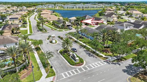 an aerial view of a house with yard swimming pool and outdoor seating