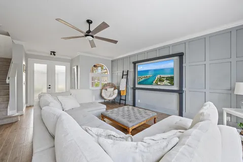 a living room with furniture and a rug
