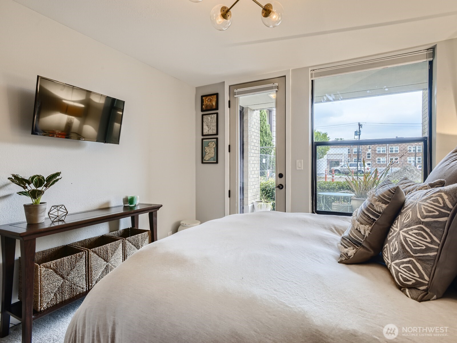 201 Galer Street, Unit 163 Seattle, WA 98109 - Photo 12 of 26 a bedroom with a bed and large windows