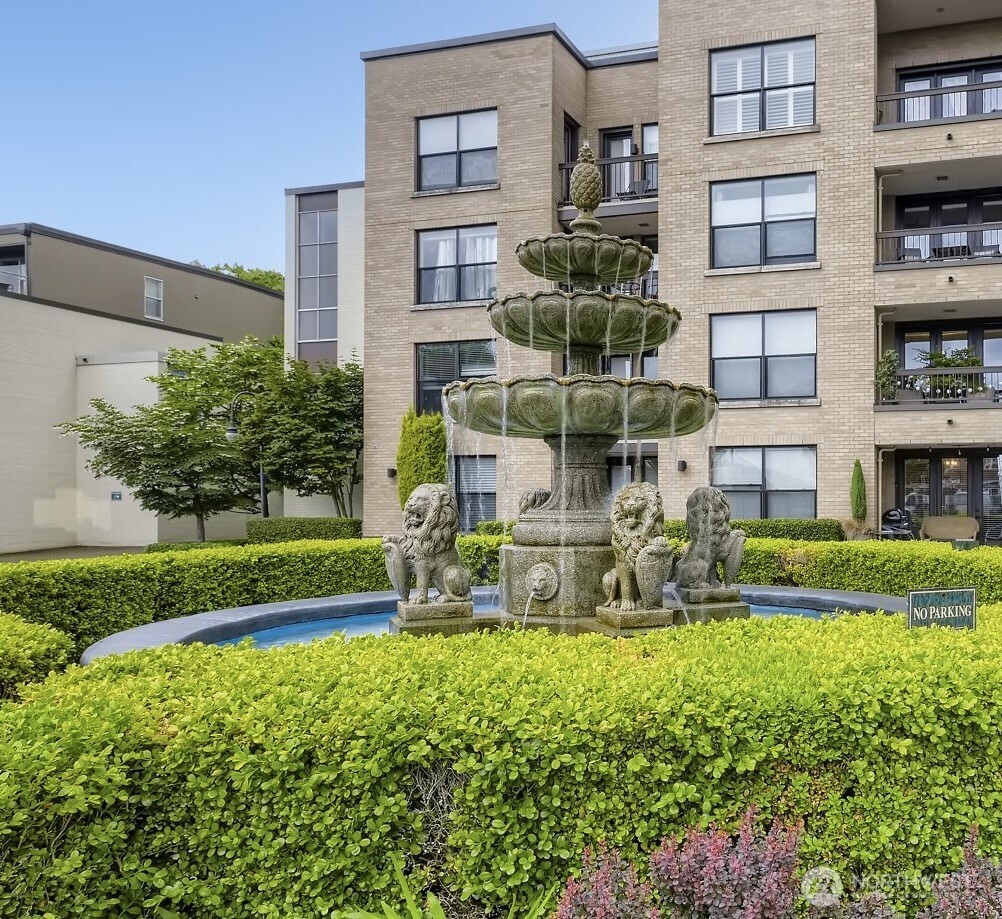 201 Galer Street, Unit 163 Seattle, WA 98109 - Photo 15 of 26 a view of a building with a yard and sitting area