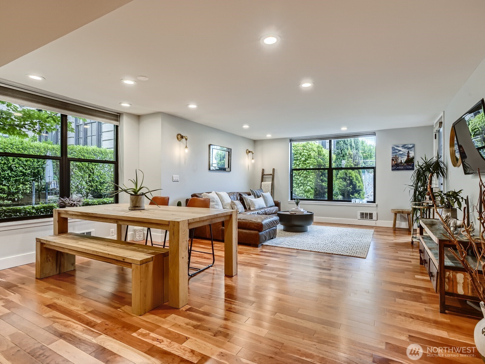 201 Galer Street, Unit 163 Seattle, WA 98109 - Photo 2 of 26 a living room with fireplace furniture and a large window