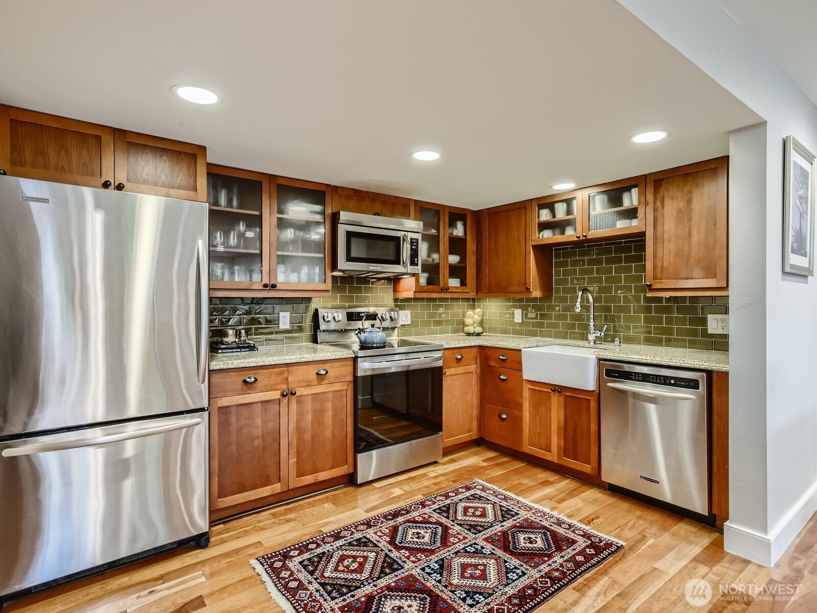 201 Galer Street, Unit 163 Seattle, WA 98109 - Photo 3 of 26 a kitchen with stainless steel appliances granite countertop a refrigerator stove top oven and sink