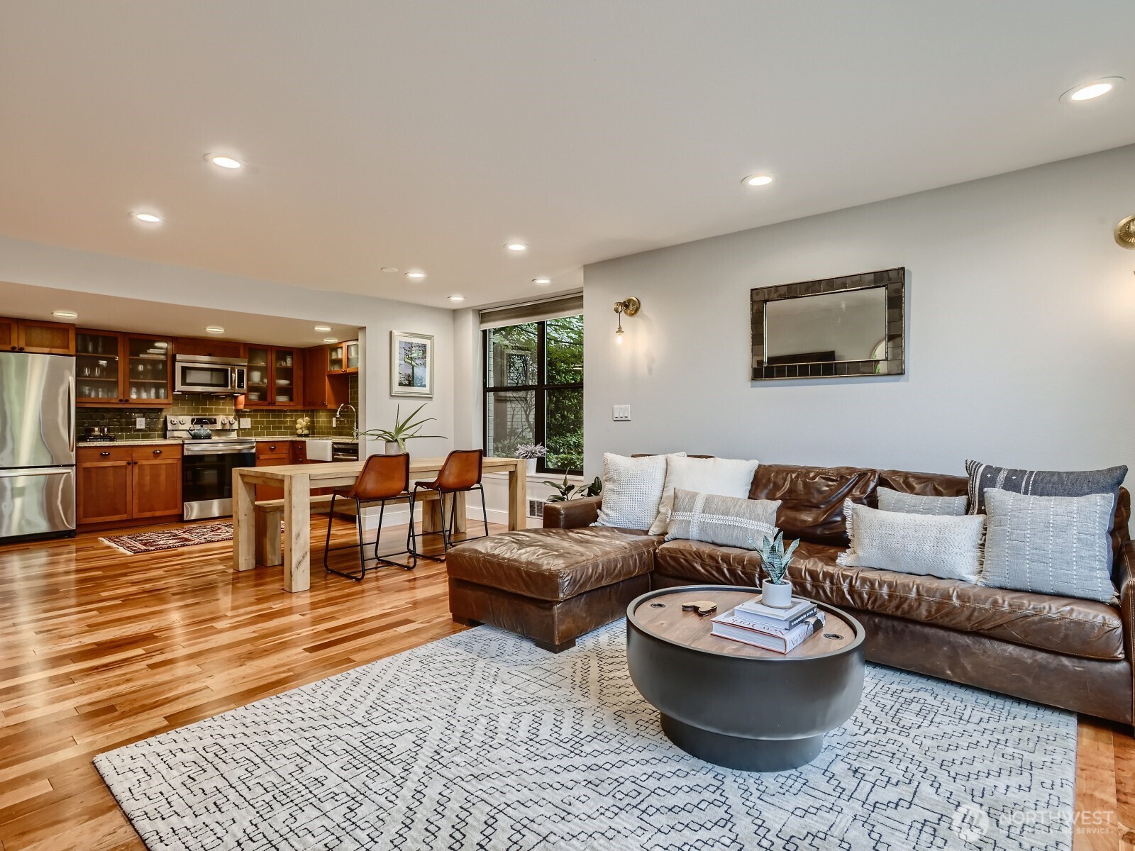 201 Galer Street, Unit 163 Seattle, WA 98109 - Photo 8 of 26 a living room with furniture and view of kitchen