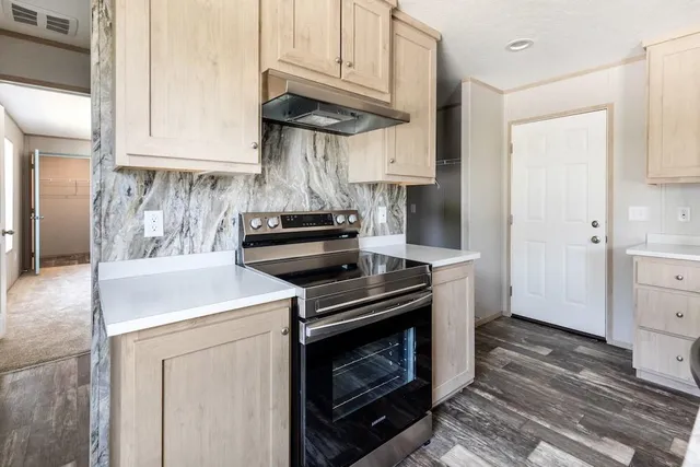 a kitchen with a stove and a microwave