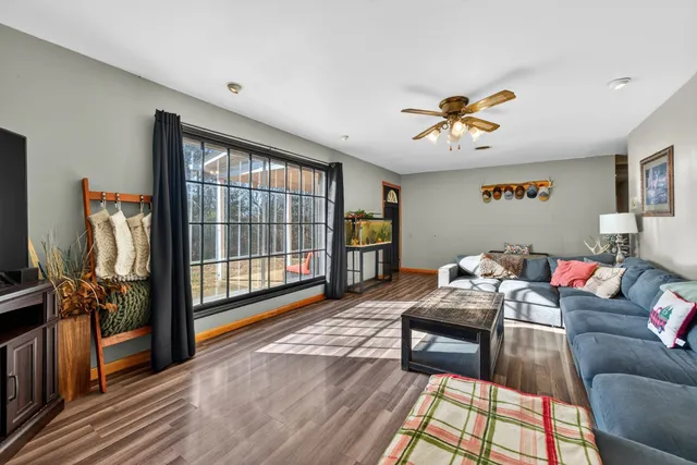 a living room with furniture fireplace and a flat screen tv