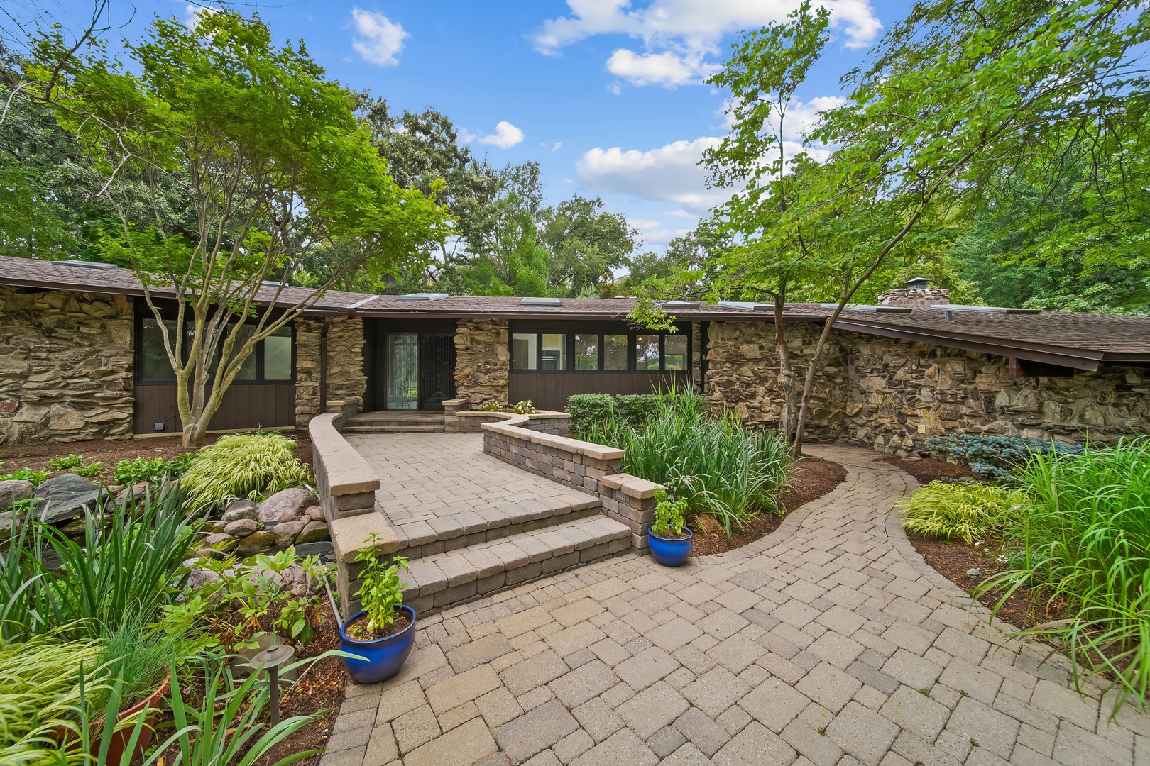 730 Plum Tree Road Barrington Hills, IL 60010 - Photo 6 of 57 a view of a wooden deck and a patio