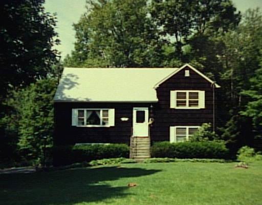 127 Taylor Road New Milford, CT 06776 - Photo 1 of 1 a front view of a house with a yard