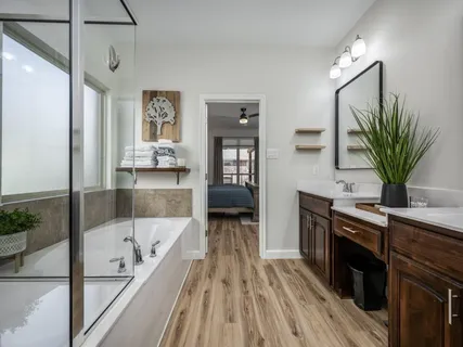 a bathroom with a bathtub and a sink