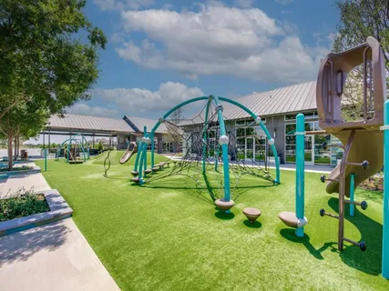 a view of playground with a slide and swing