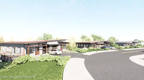 a view of a house with a swimming pool and sitting area