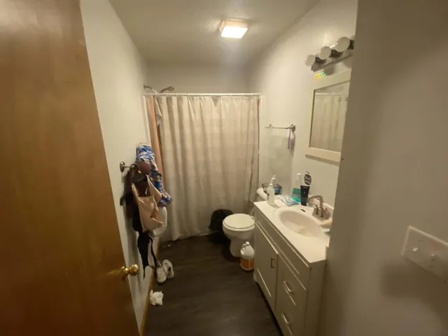 a bathroom with a double vanity sink and mirror