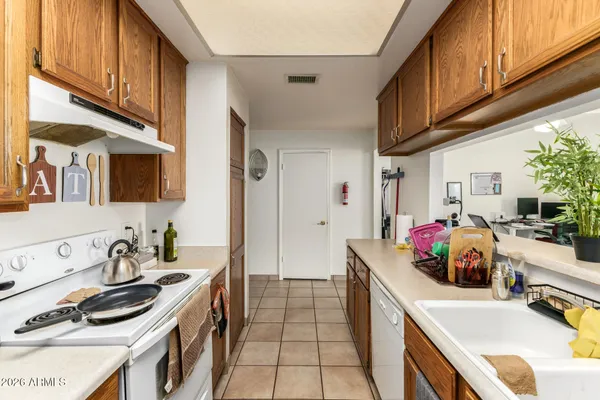 a kitchen that has a sink and a stove