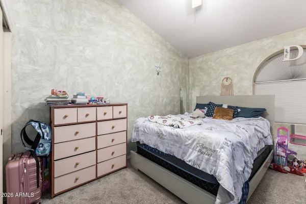a bedroom with a bed and a cabinets