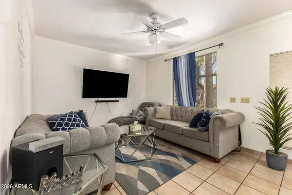 a living room with furniture and a flat screen tv
