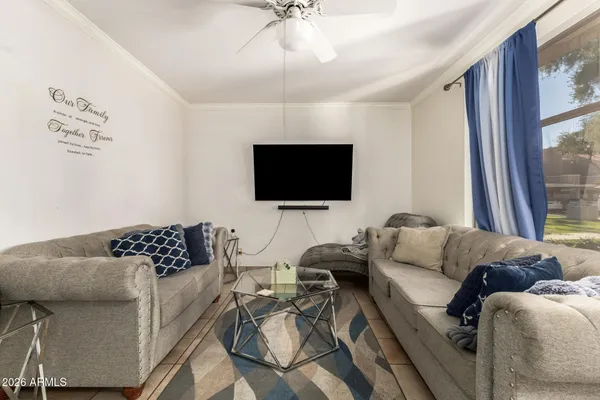 a living room with furniture and a flat screen tv