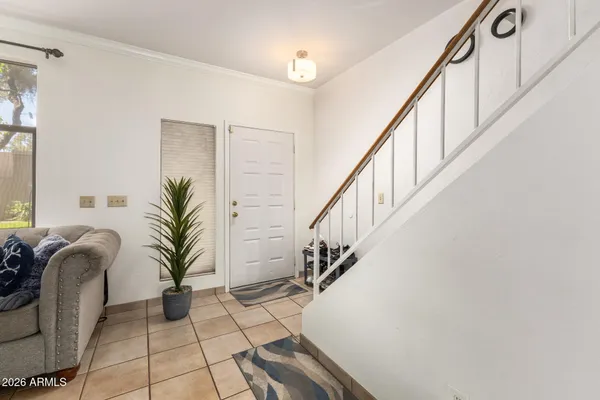 a view of entryway with wooden floor and a potted plant
