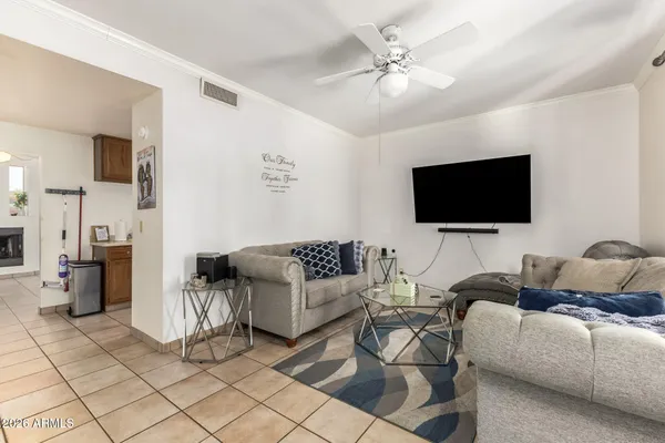 a living room with furniture and a flat screen tv