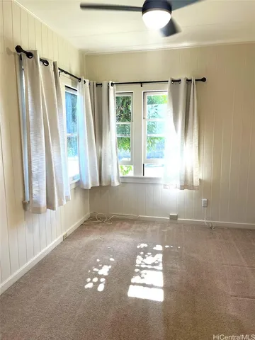 a view of livingroom with furniture and window