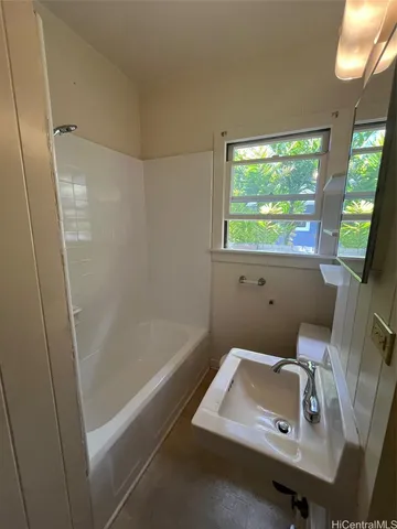 a bathroom with a sink and a large window