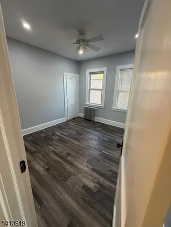 a view of an empty room and a window