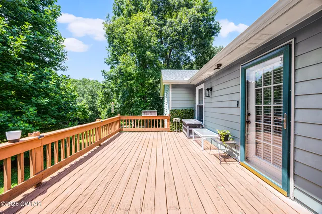 a view of balcony with deck and wooden floor