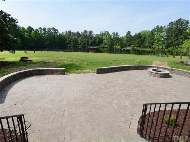 651 Friendship Church Road Middlesex, NC 27557 - Photo 19 of 25 View of the Cobblestone Patio on Front of Home with Built in Firepit Patio/Deck