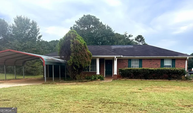 a house view with a garden space