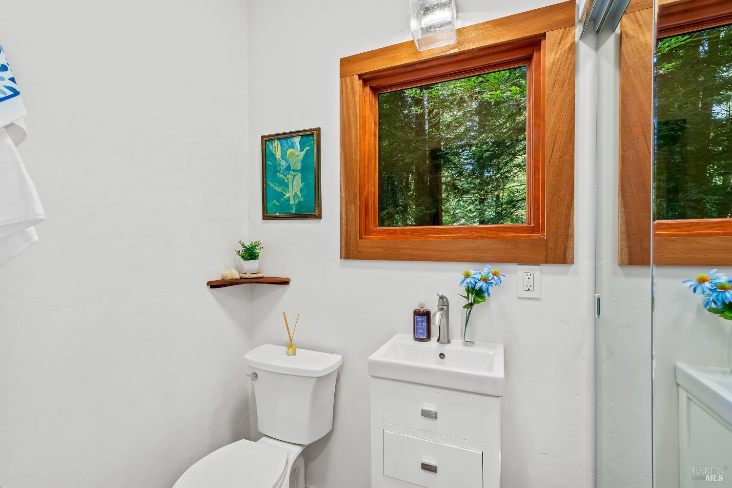 18475 Old Monte Rio Road Guerneville, CA 95446 - Photo 19 of 64 Remodeled bathroom with newer vanity, toilet, lighting, closet, flooring