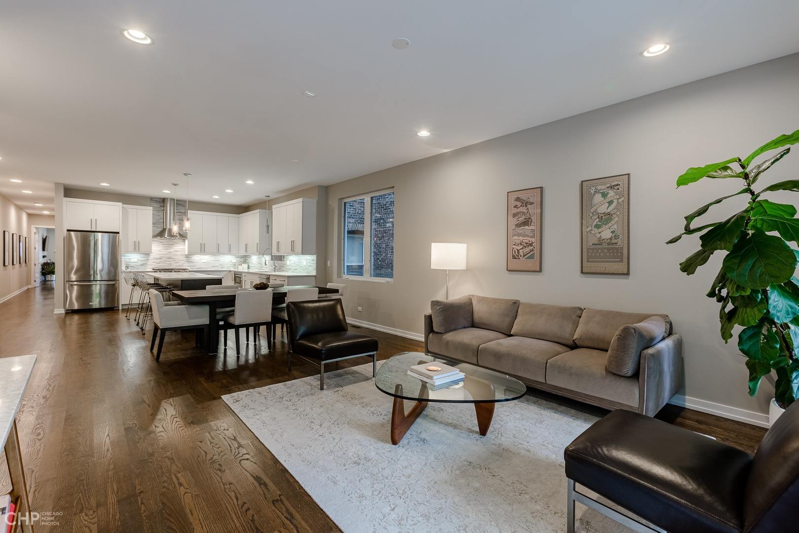 1033 South Racine Avenue, Unit 1S Chicago, IL 60607 - Photo 2 of 32 a living room with furniture and a dining table with wooden floor