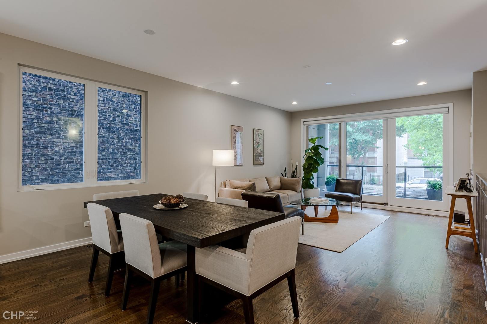 1033 South Racine Avenue, Unit 1S Chicago, IL 60607 - Photo 12 of 32 a living room with furniture and a large window