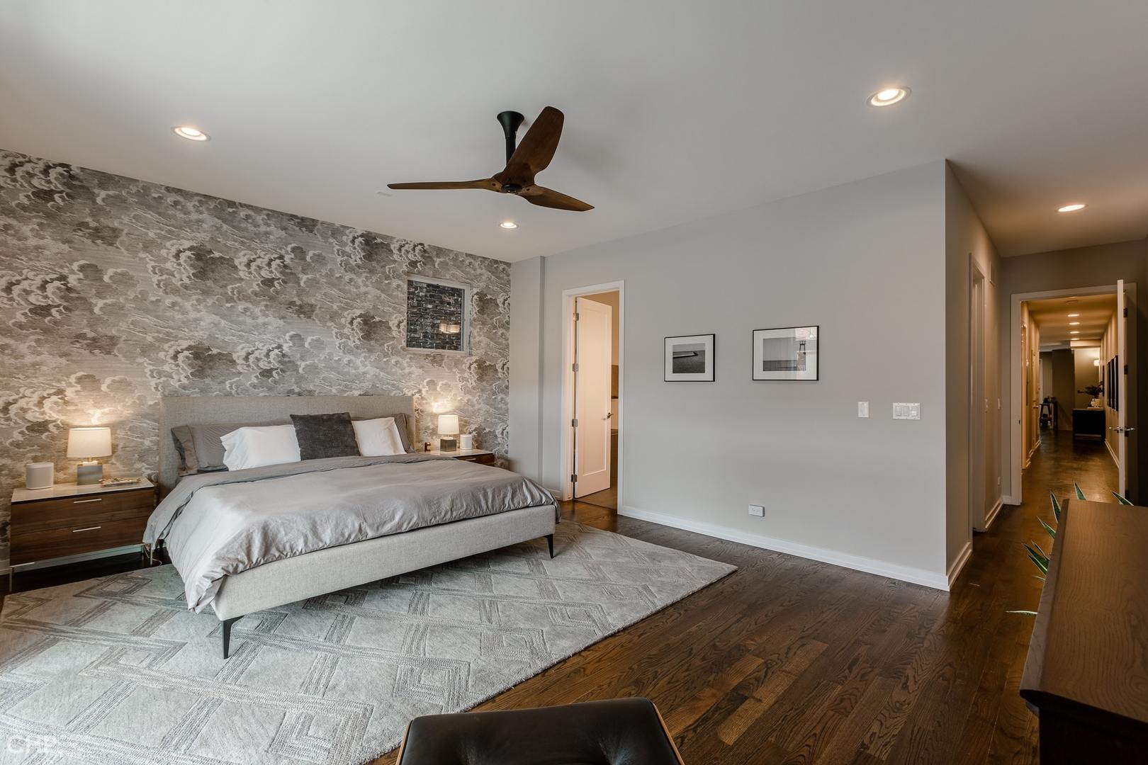 1033 South Racine Avenue, Unit 1S Chicago, IL 60607 - Photo 13 of 32 a bedroom with a large bed and wooden floor
