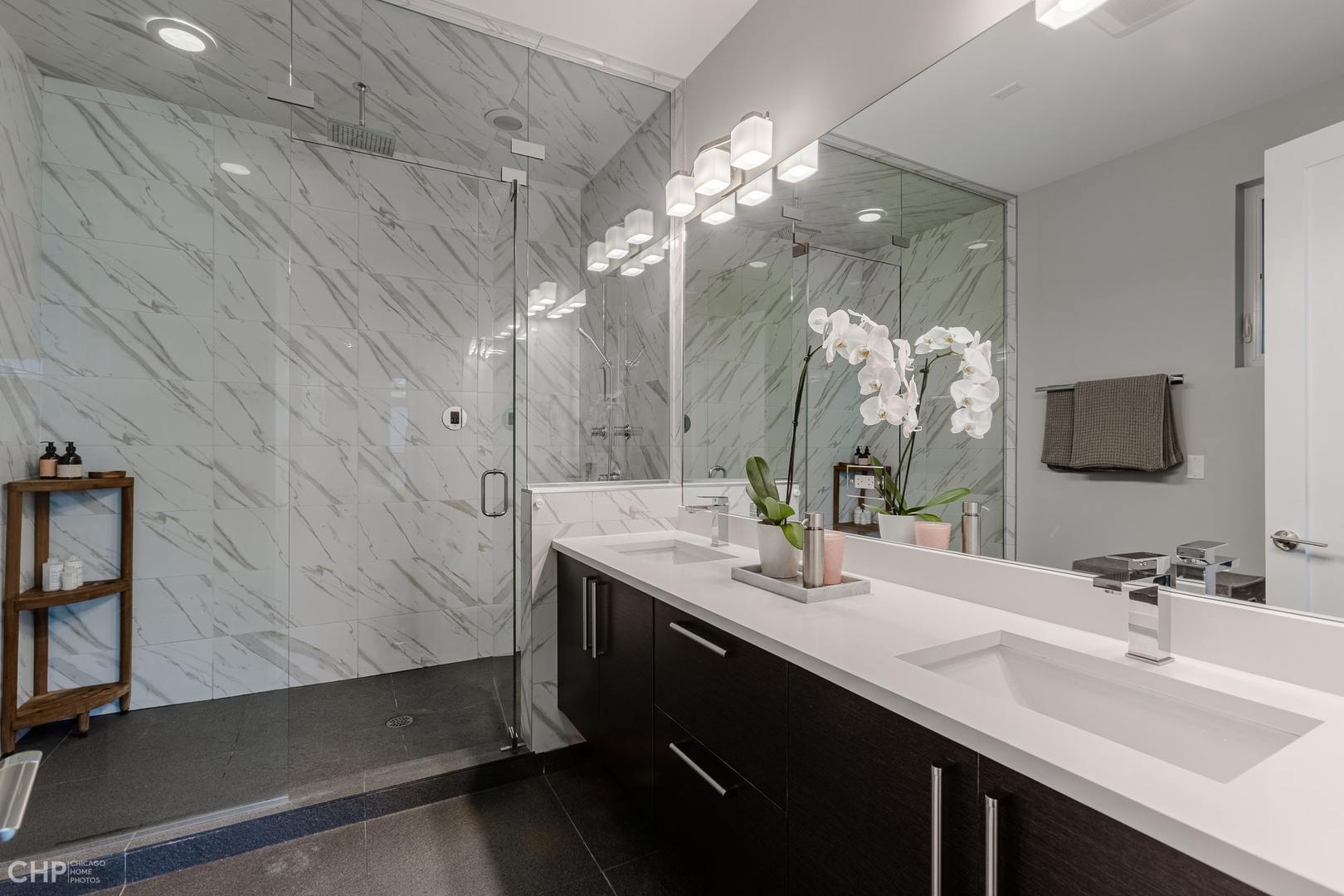 1033 South Racine Avenue, Unit 1S Chicago, IL 60607 - Photo 21 of 32 a bathroom with a sink double vanity and a mirror