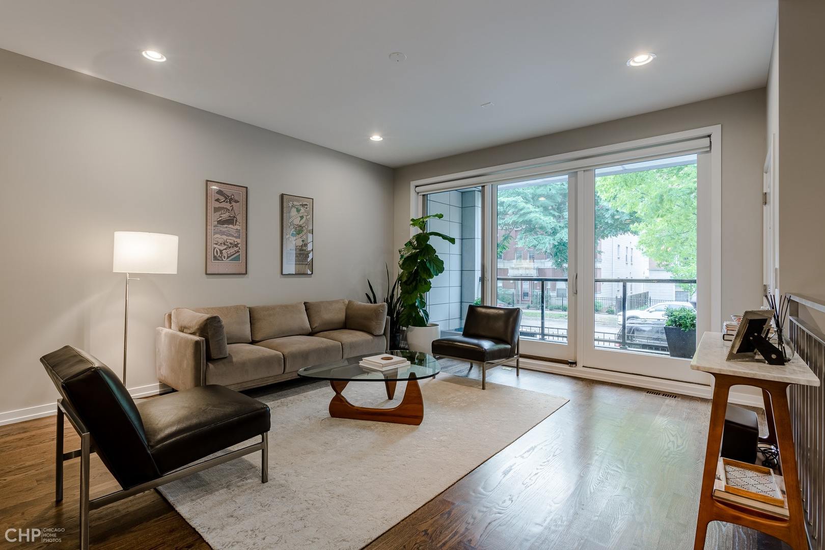 1033 South Racine Avenue, Unit 1S Chicago, IL 60607 - Photo 5 of 32 a living room with furniture and a large window