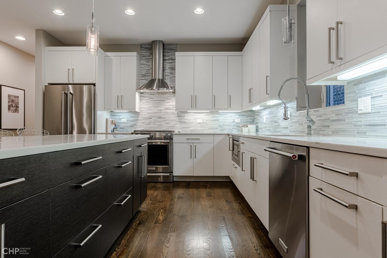 1033 South Racine Avenue, Unit 1S Chicago, IL 60607 - Photo 8 of 32 a kitchen with granite countertop a sink stove refrigerator and cabinets