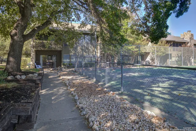 a view of a lake with a house in the background