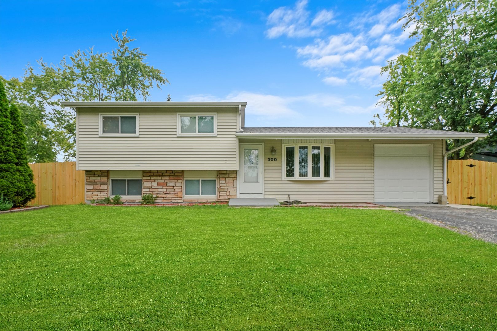 300 Hadleigh Road Bolingbrook, IL 60440 - Photo 1 of 45 a front view of a house with a garden