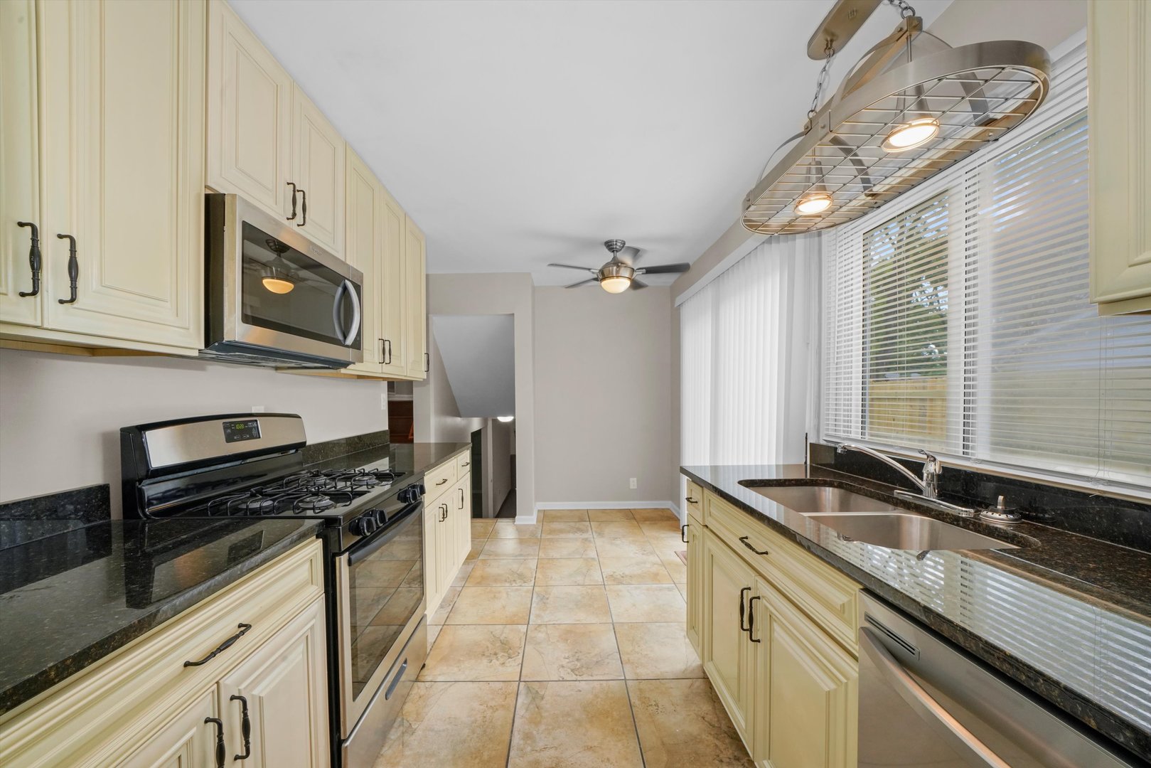 300 Hadleigh Road Bolingbrook, IL 60440 - Photo 14 of 45 a kitchen that has a sink and a stove top oven