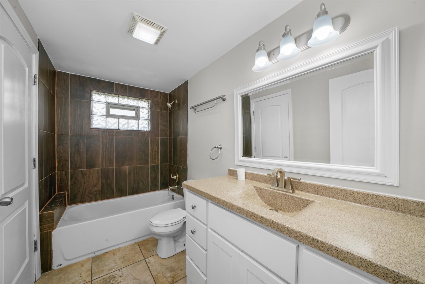 300 Hadleigh Road Bolingbrook, IL 60440 - Photo 15 of 45 a bathroom with a granite countertop sink a toilet and shower