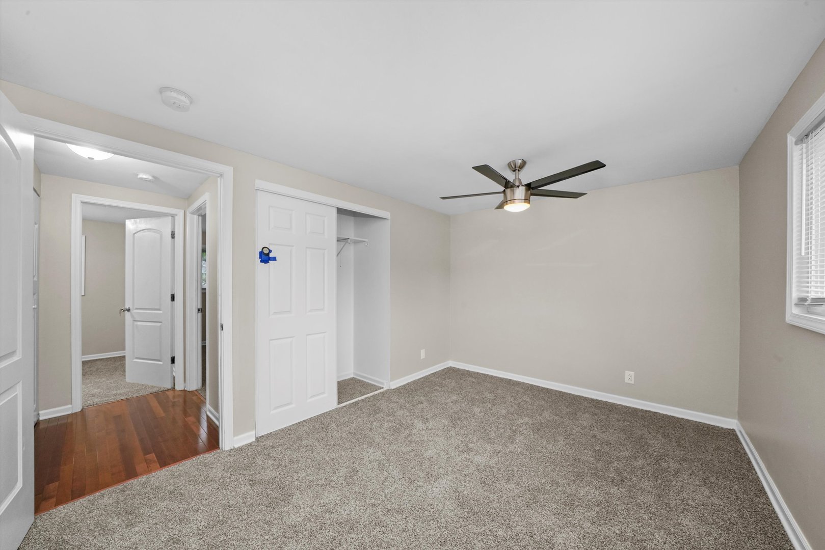 300 Hadleigh Road Bolingbrook, IL 60440 - Photo 17 of 45 a view of a livingroom with a ceiling fan and window