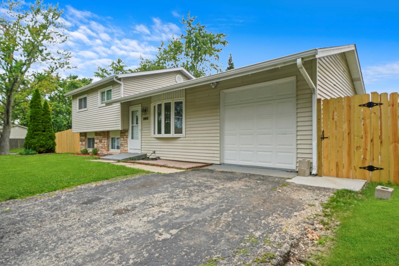 300 Hadleigh Road Bolingbrook, IL 60440 - Photo 2 of 45 a front view of a house with garden