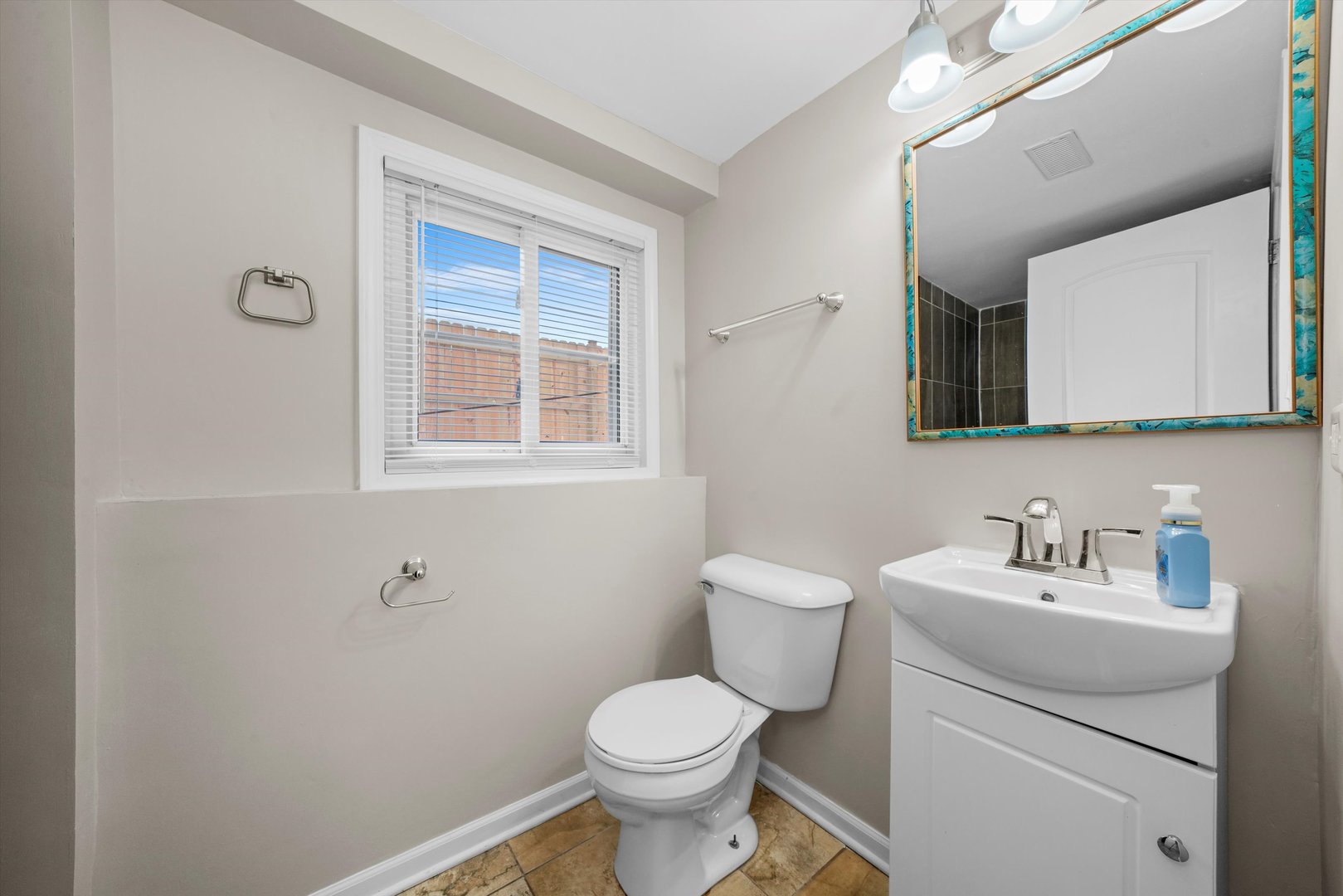 300 Hadleigh Road Bolingbrook, IL 60440 - Photo 28 of 45 a bathroom with a toilet sink and mirror