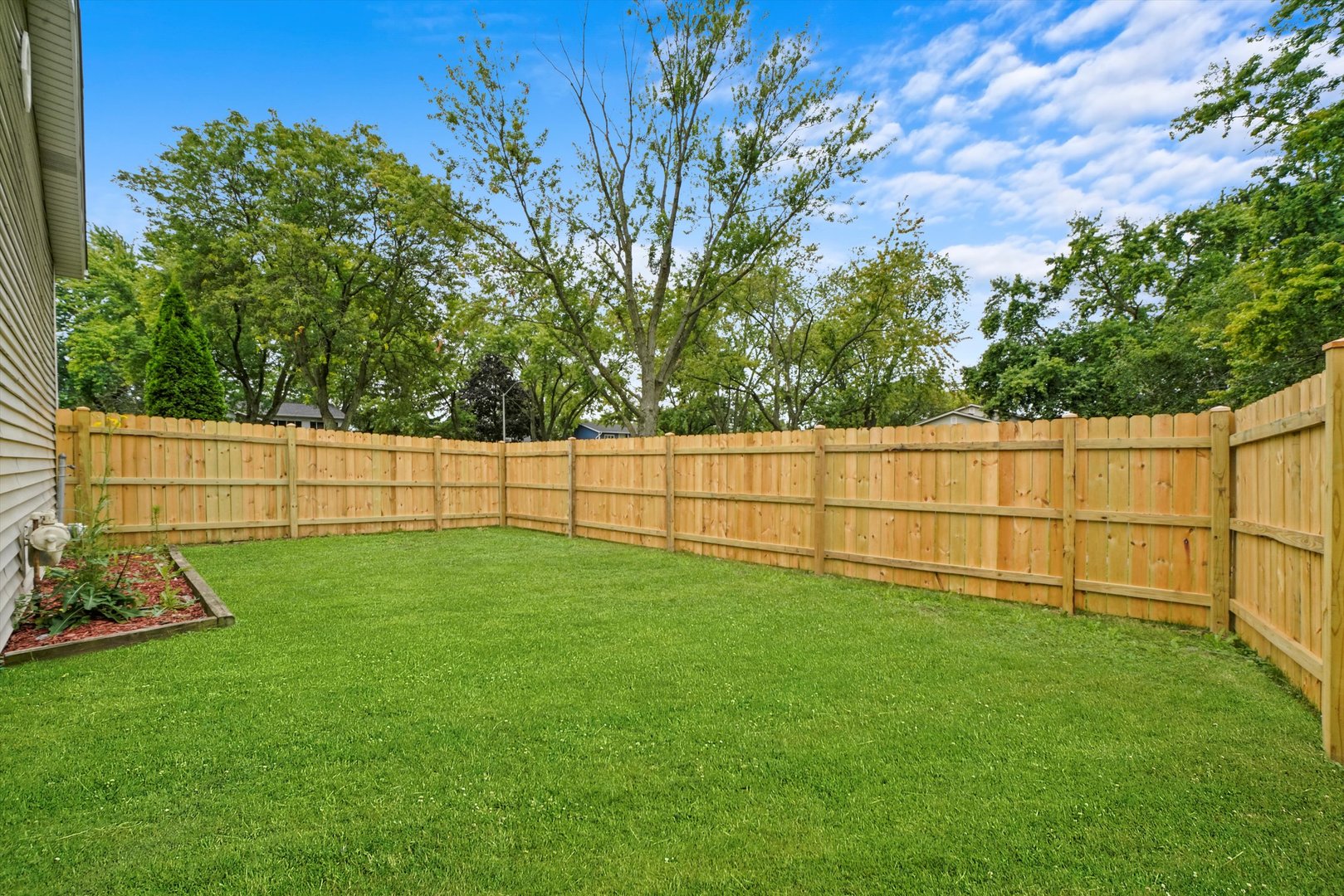 300 Hadleigh Road Bolingbrook, IL 60440 - Photo 38 of 45 a view of a backyard with fence