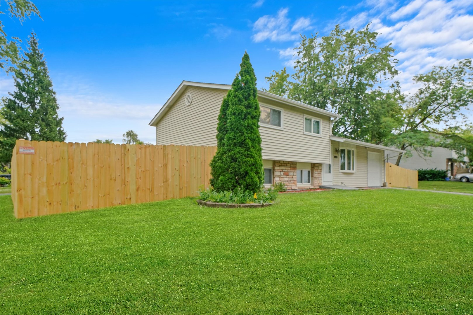 300 Hadleigh Road Bolingbrook, IL 60440 - Photo 39 of 45 a view of a backyard with plants and large trees