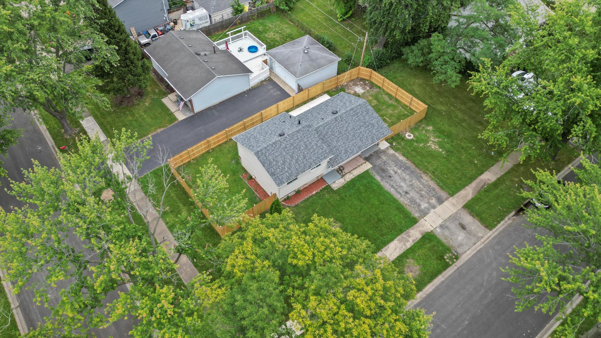300 Hadleigh Road Bolingbrook, IL 60440 - Photo 40 of 45 an aerial view of a house with a yard