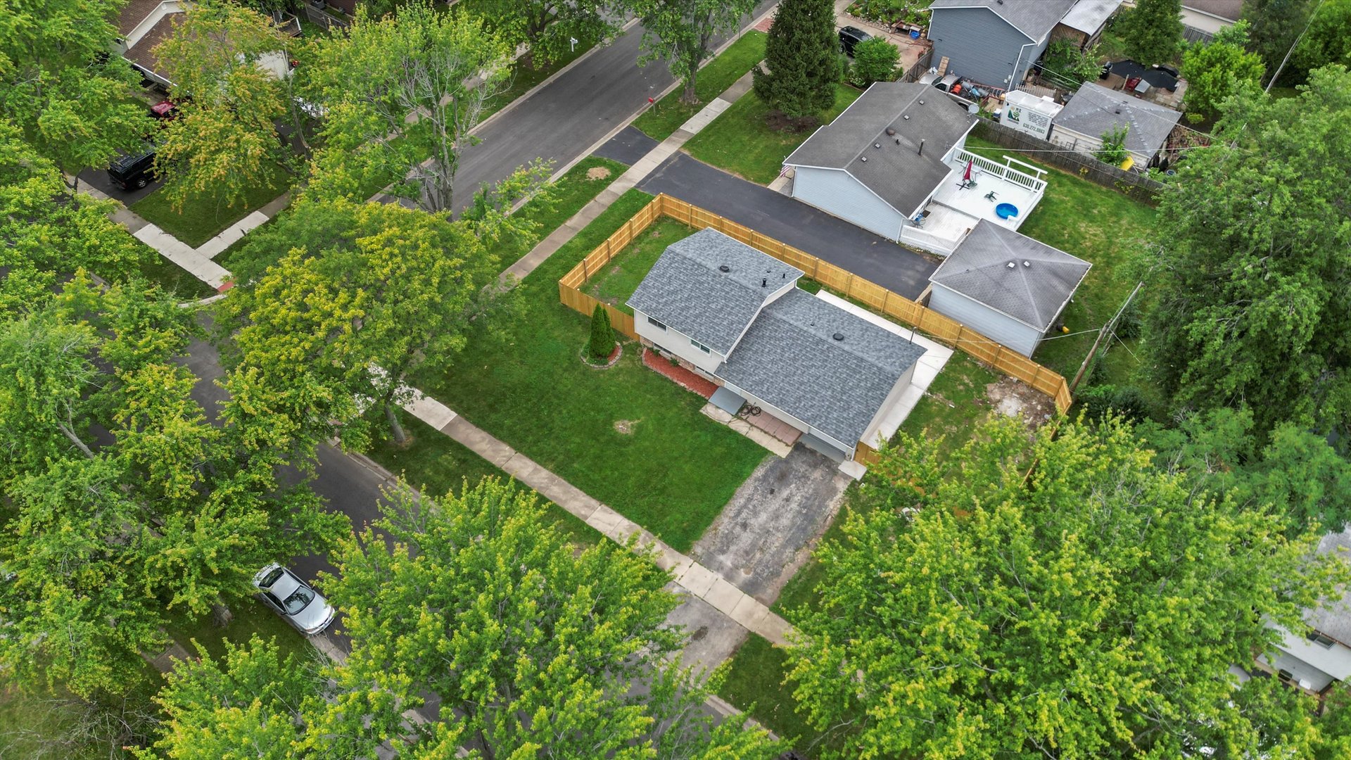 300 Hadleigh Road Bolingbrook, IL 60440 - Photo 42 of 45 an aerial view of a house with a yard and trees