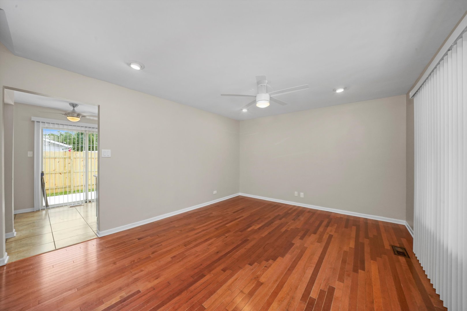 300 Hadleigh Road Bolingbrook, IL 60440 - Photo 5 of 45 wooden floor in an empty room with a window