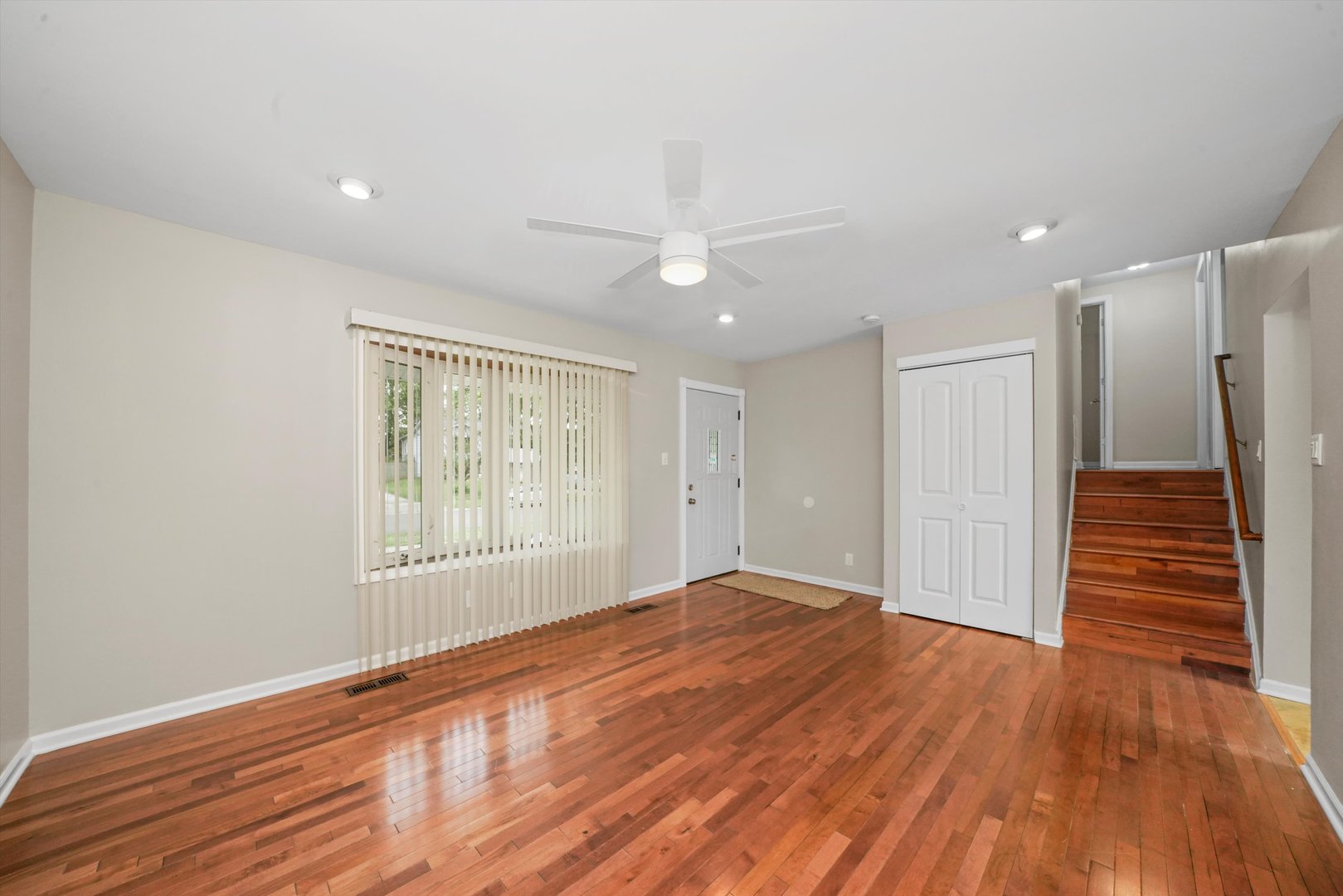300 Hadleigh Road Bolingbrook, IL 60440 - Photo 6 of 45 a view of an empty room with wooden floor and a window