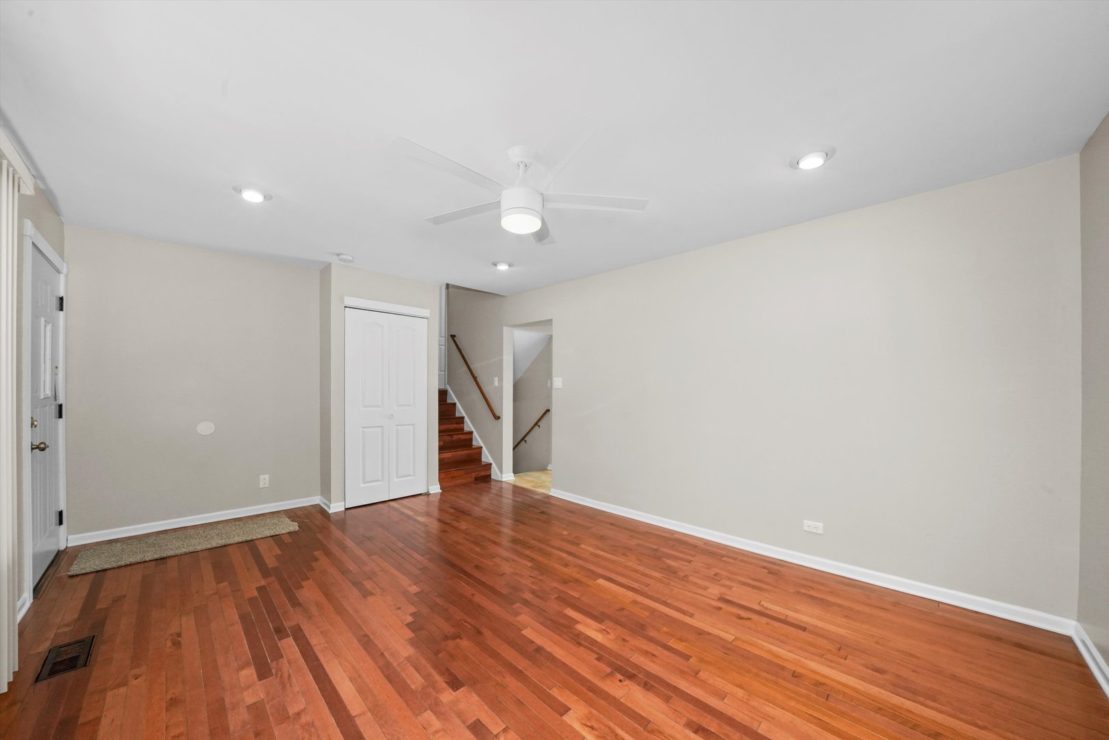 300 Hadleigh Road Bolingbrook, IL 60440 - Photo 7 of 45 a view of an empty room with wooden floor