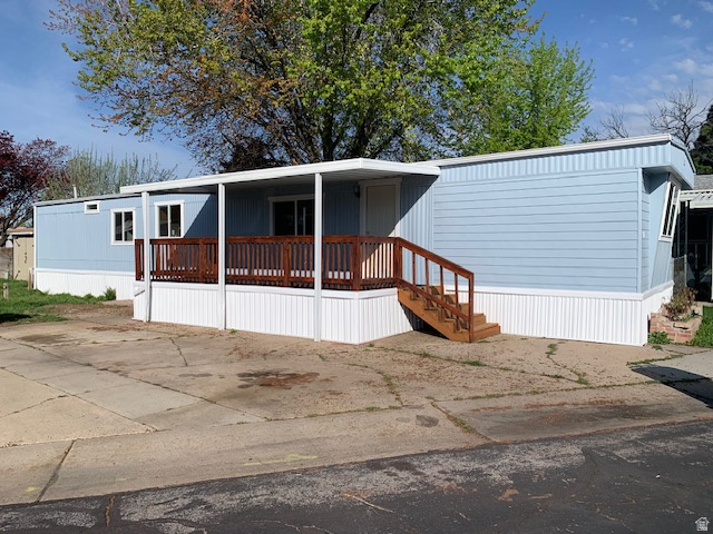 1500 North Angel Street West, Unit 56 Layton, UT 84041 - Photo 2 of 20 Manufactured / mobile home featuring covered porch